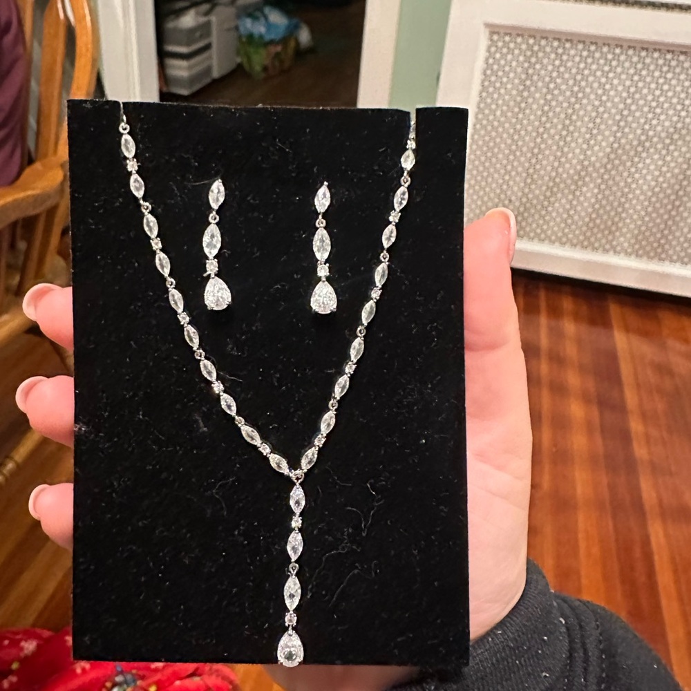 Adora silver toned cubic zirconia bridal necklace and earring set.